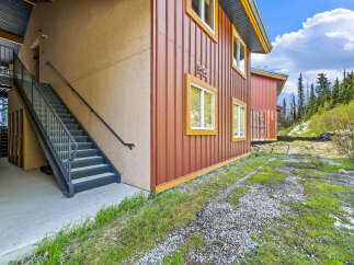 Discover this charming property featuring a durable metal exterior and a welcoming stucco finish.