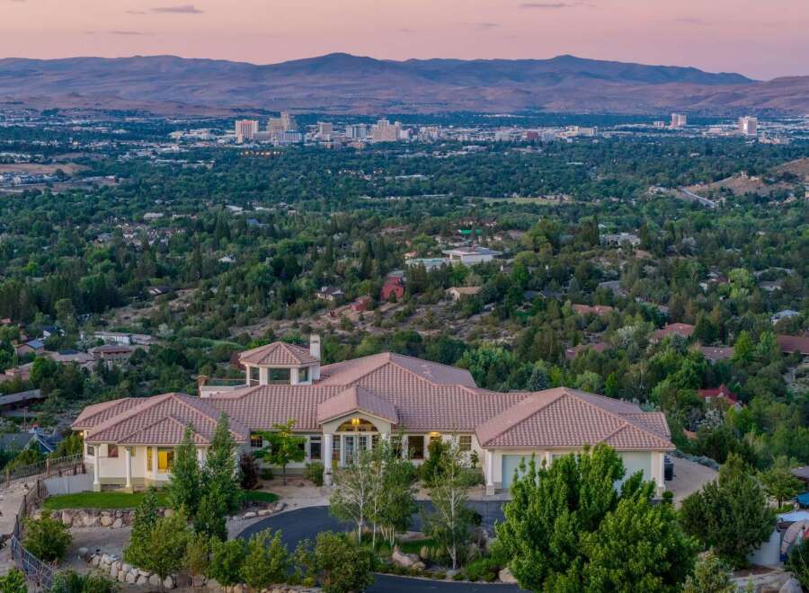 Experience luxury living with this stunning estate offering panoramic city and mountain views.
