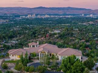 Experience luxury living with this stunning estate offering panoramic city and mountain views.