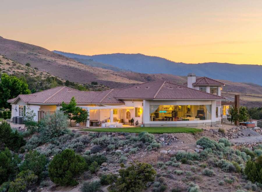 Experience luxury living in this stunning estate nestled against rolling hills.