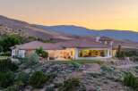 Experience luxury living in this stunning estate nestled against rolling hills.