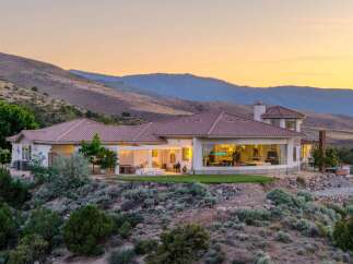 Experience luxury living in this stunning estate nestled against rolling hills.