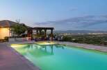 Experience luxury living with this stunning property featuring a sparkling swimming pool and an integrated spa, perfect for relaxation and entertainment.