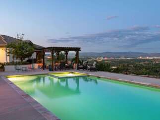 Experience luxury living with this stunning property featuring a sparkling swimming pool and an integrated spa, perfect for relaxation and entertainment.