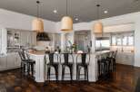 Experience luxury in this stunning kitchen featuring a large island with bar seating, perfect for entertaining.