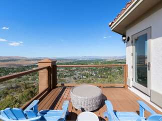 Enjoy breathtaking panoramic views from this stunning deck, perfect for entertaining or quiet relaxation.
