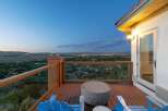 Enjoy breathtaking panoramic views from this stunning deck, perfect for evening relaxation.