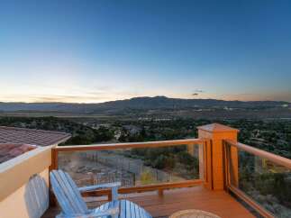 Enjoy breathtaking panoramic views from this stunning deck, perfect for unwinding or entertaining.