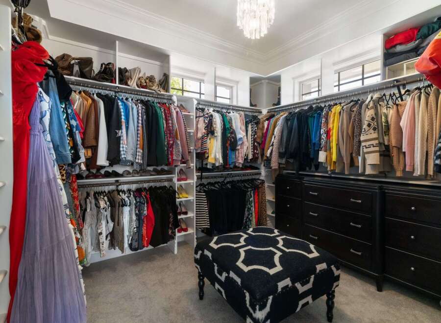 Step into this luxurious walk-in closet, a fashion lover's dream.