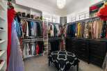 Step into this luxurious walk-in closet, a fashion lover's dream.