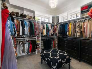 Step into this luxurious walk-in closet, a fashion lover's dream.