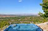 Experience breathtaking panoramic views from this stunning property, featuring a luxurious hot tub perfect for relaxation.