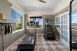 Elevate your fitness routine in this dedicated home gym, featuring a treadmill and stair climber for a comprehensive workout.