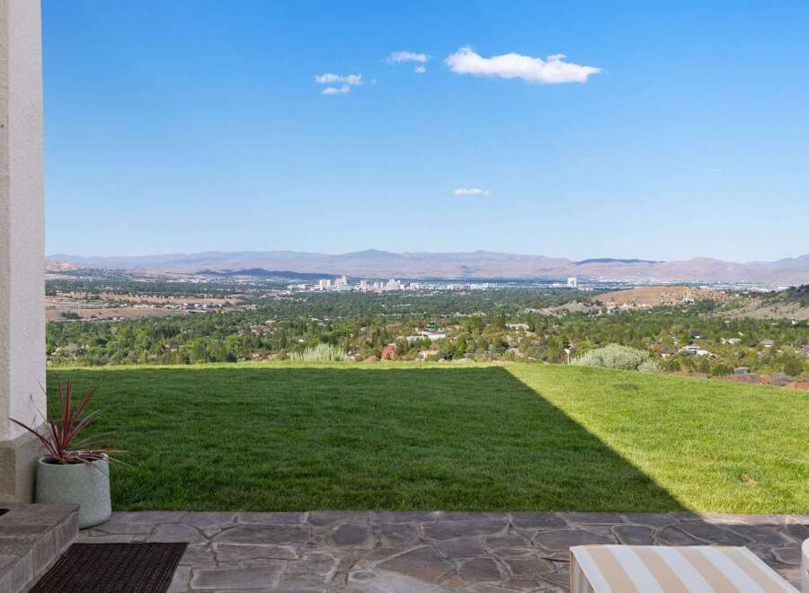 Experience breathtaking panoramic views of the city skyline and surrounding mountains from this stunning property.