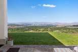 Experience breathtaking panoramic views of the city skyline and surrounding mountains from this stunning property.