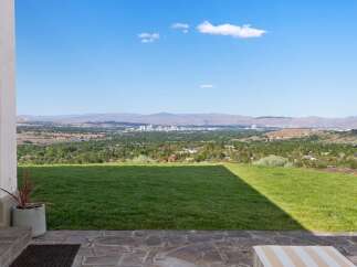 Experience breathtaking panoramic views of the city skyline and surrounding mountains from this stunning property.