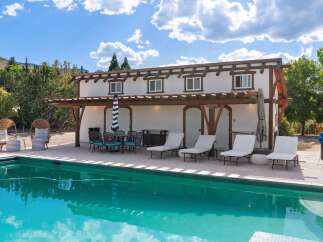 Enjoy ultimate relaxation by this stunning swimming pool, perfect for sunny days and evening dips.
