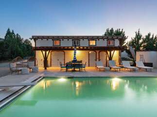 Experience luxury outdoor living with this stunning property featuring a sparkling swimming pool and a covered patio perfect for al fresco dining.