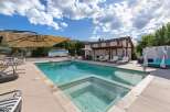 Escape to this stunning desert oasis featuring a sparkling swimming pool and integrated hot tub, perfect for relaxation and entertainment.