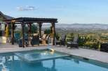 Enjoy breathtaking panoramic views from this stunning property, featuring a luxurious pool and spa area perfect for relaxation and entertainment.