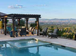 Enjoy breathtaking panoramic views from this stunning property, featuring a luxurious pool and spa area perfect for relaxation and entertainment.