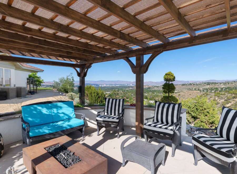 Enjoy breathtaking panoramic views from this stunning covered patio, perfect for outdoor entertaining.