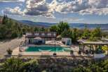 Escape to this stunning property featuring a sparkling swimming pool and relaxing hot tub, perfect for unwinding.