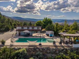 Escape to this stunning property featuring a sparkling swimming pool and relaxing hot tub, perfect for unwinding.