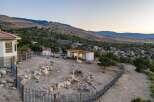 Discover this unique property nestled in a serene, hilly landscape, perfect for animal lovers.