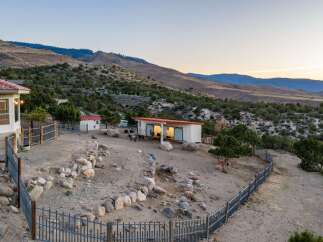 Discover this unique property nestled in a serene, hilly landscape, perfect for animal lovers.