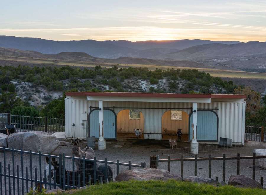 Experience serene country living with this unique property featuring a converted shipping container barn.