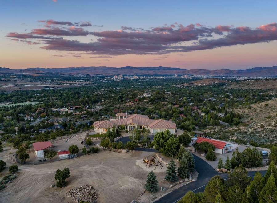 Experience luxury living with this stunning estate offering panoramic views of the city and mountains.