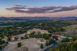Experience luxury living with this stunning estate offering panoramic views of the city and mountains.