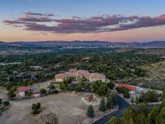Experience luxury living with this stunning estate offering panoramic views of the city and mountains.