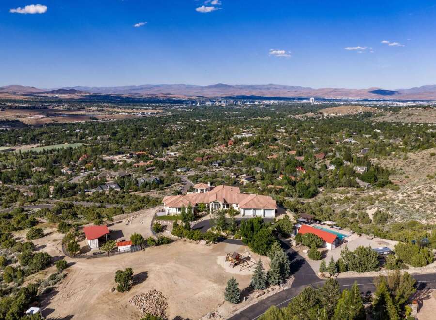 Experience luxury living in this expansive estate, boasting a sprawling main residence with a multi-car garage and a separate guest house.