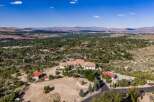 Experience luxury living in this expansive estate, boasting a sprawling main residence with a multi-car garage and a separate guest house.