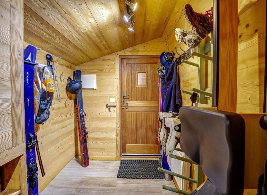 This ski storage room offers a practical and organized space for all your winter gear.