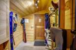 This ski storage room offers a practical and organized space for all your winter gear.