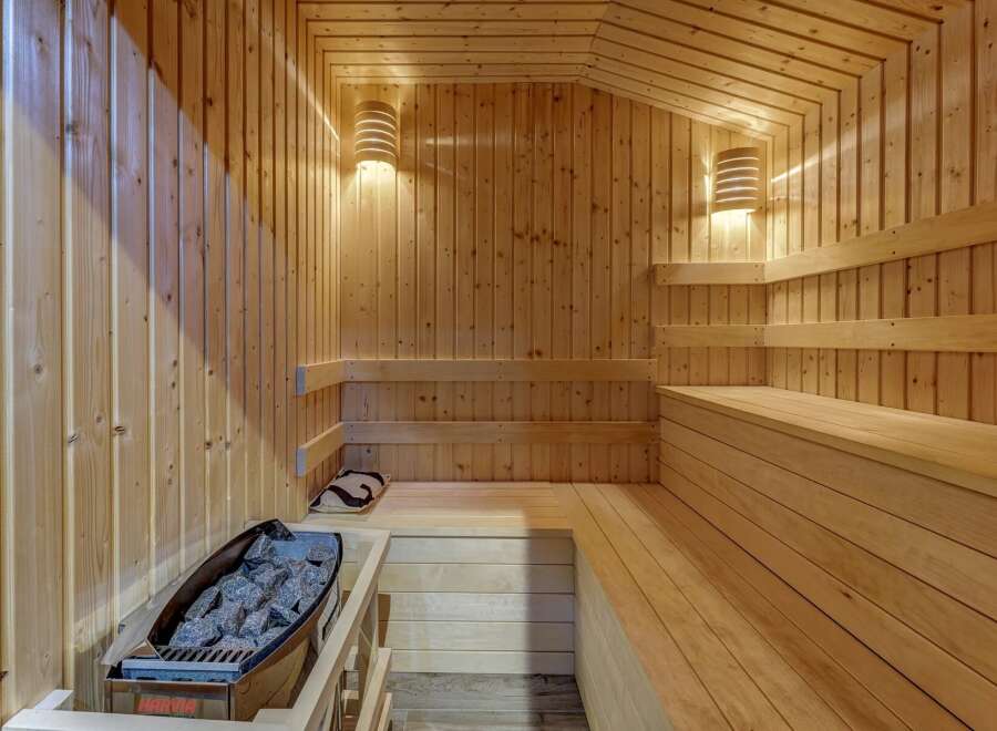 Experience ultimate relaxation in this beautifully crafted wooden sauna.
