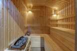 Experience ultimate relaxation in this beautifully crafted wooden sauna.