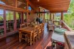 Experience outdoor living at its finest on this expansive covered deck, perfect for entertaining or relaxing amidst stunning mountain views.
