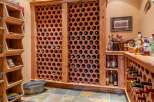 Discover the ultimate wine enthusiast's dream with this custom-built wine cellar, featuring hexagonal terracotta racks for optimal bottle storage and preservation.