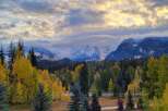 Experience the breathtaking beauty of autumn from this stunning property, nestled amidst vibrant golden aspen trees and majestic snow-capped mountains.