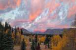 Experience the magic of autumn in this stunning mountain landscape, perfect for a serene getaway.