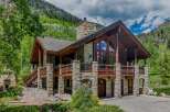 Experience luxury mountain living in this stunning stone and timber home nestled amidst breathtaking natural beauty.