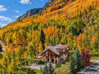 Experience the breathtaking beauty of autumn from this stunning mountain home.