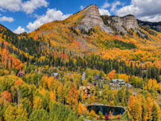 Experience the breathtaking beauty of autumn in this stunning mountain estate.