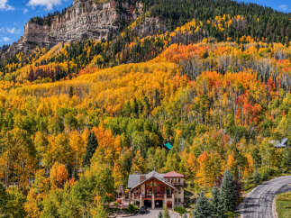 Experience the breathtaking beauty of autumn from this stunning mountain home.