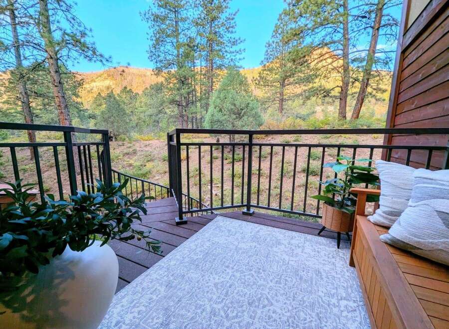 Enjoy breathtaking mountain views from this charming deck, perfect for outdoor relaxation and entertaining.