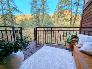 Enjoy breathtaking mountain views from this charming deck, perfect for outdoor relaxation and entertaining.